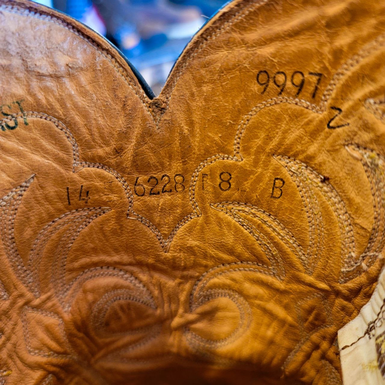 A vintage pair of HYER Lizard skin Cowboy Boots size 8B for sale after being repaired with new leather soles and rubber heels at the cowboy boot repair center