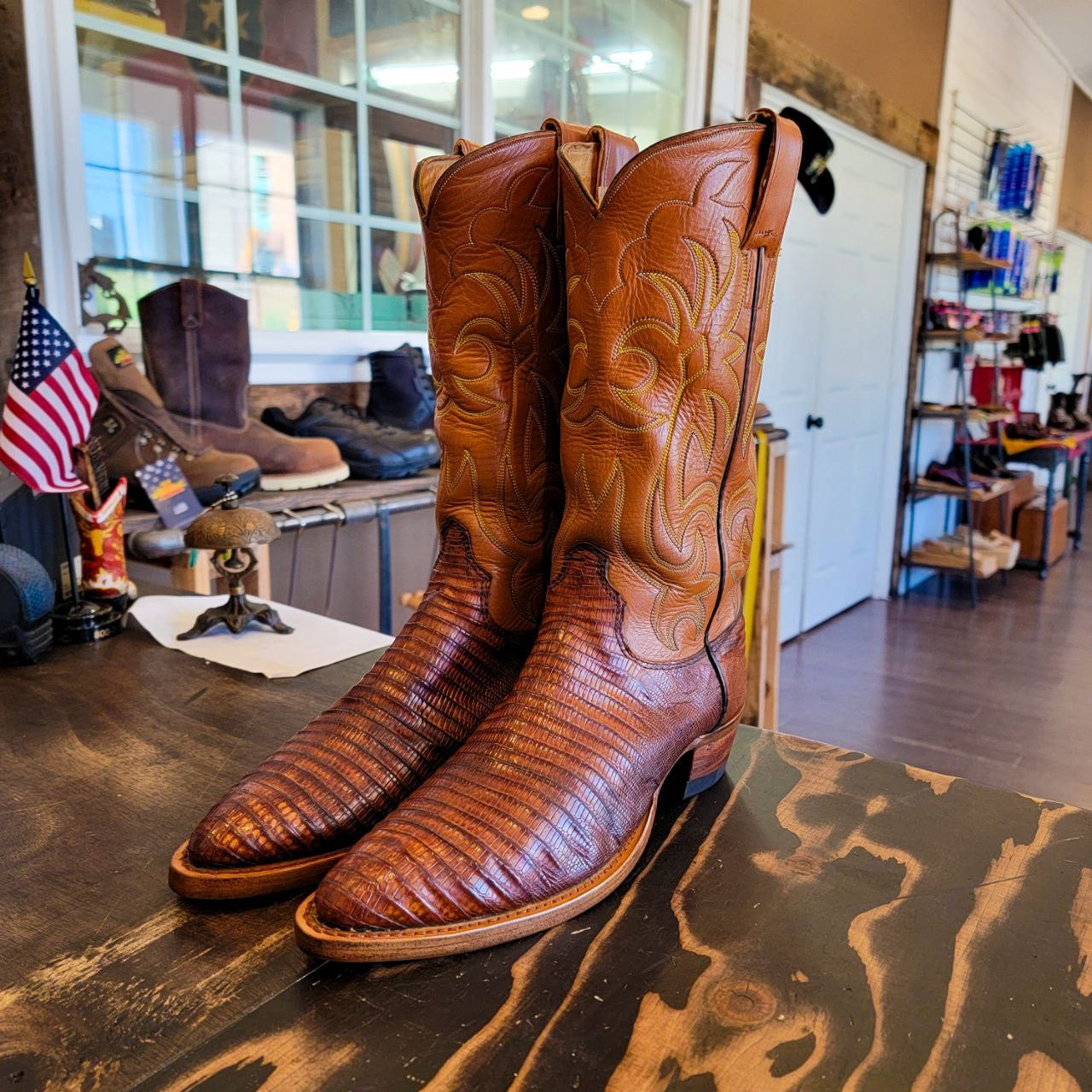 A vintage pair of HYER Lizard skin Cowboy Boots size 8B for sale after being repaired with new leather soles and rubber heels at the cowboy boot repair center