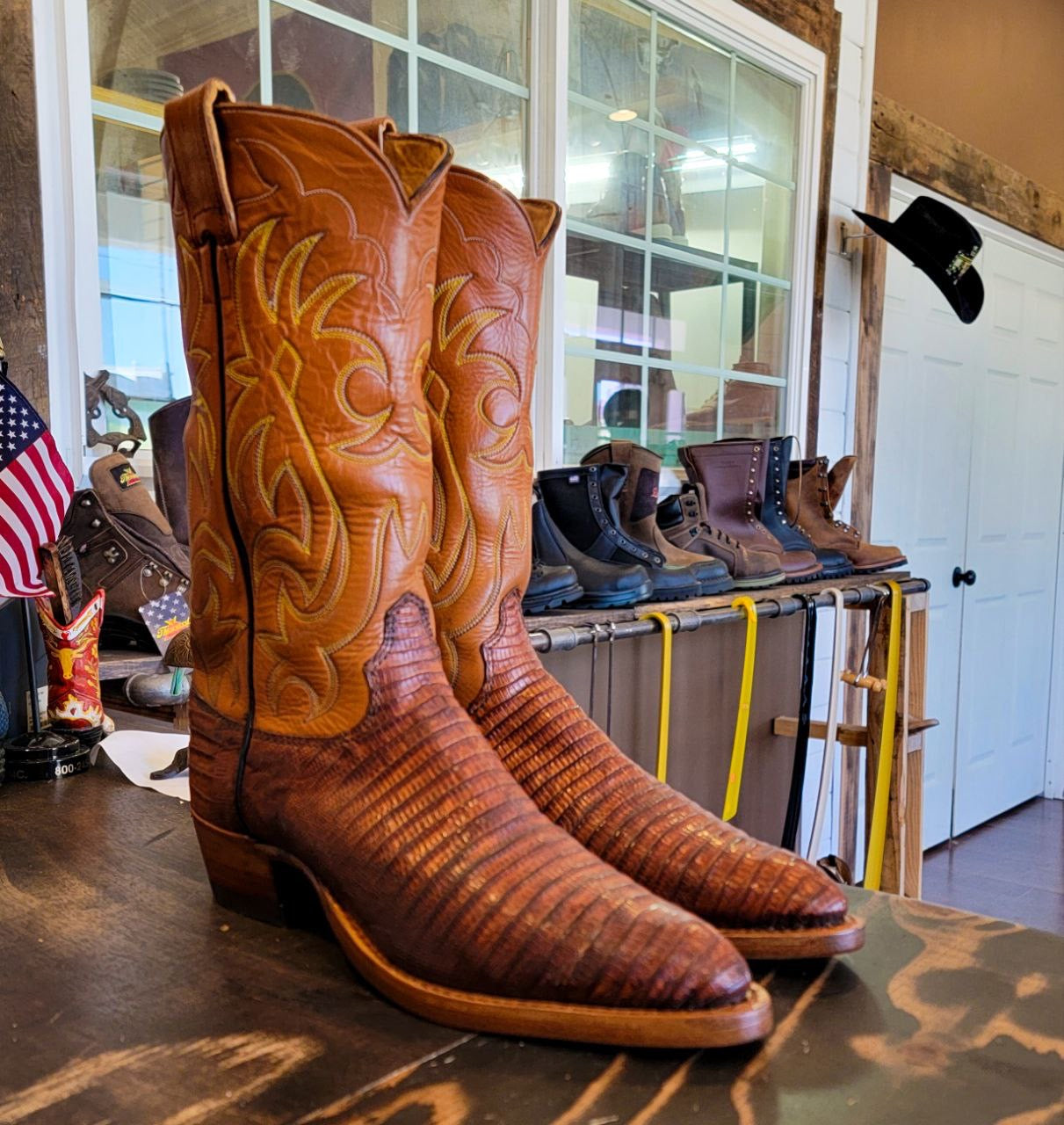 A vintage pair of HYER Lizard skin Cowboy Boots size 8B for sale after being repaired with new leather soles and rubber heels at the cowboy boot repair center