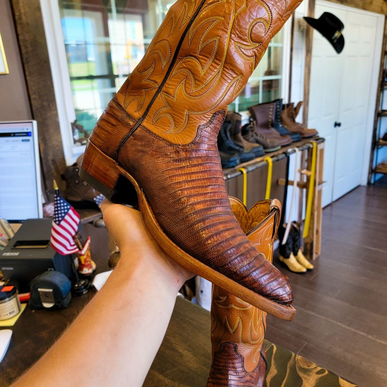 A vintage pair of HYER Lizard skin Cowboy Boots size 8B for sale after being repaired with new leather soles and rubber heels at the cowboy boot repair center