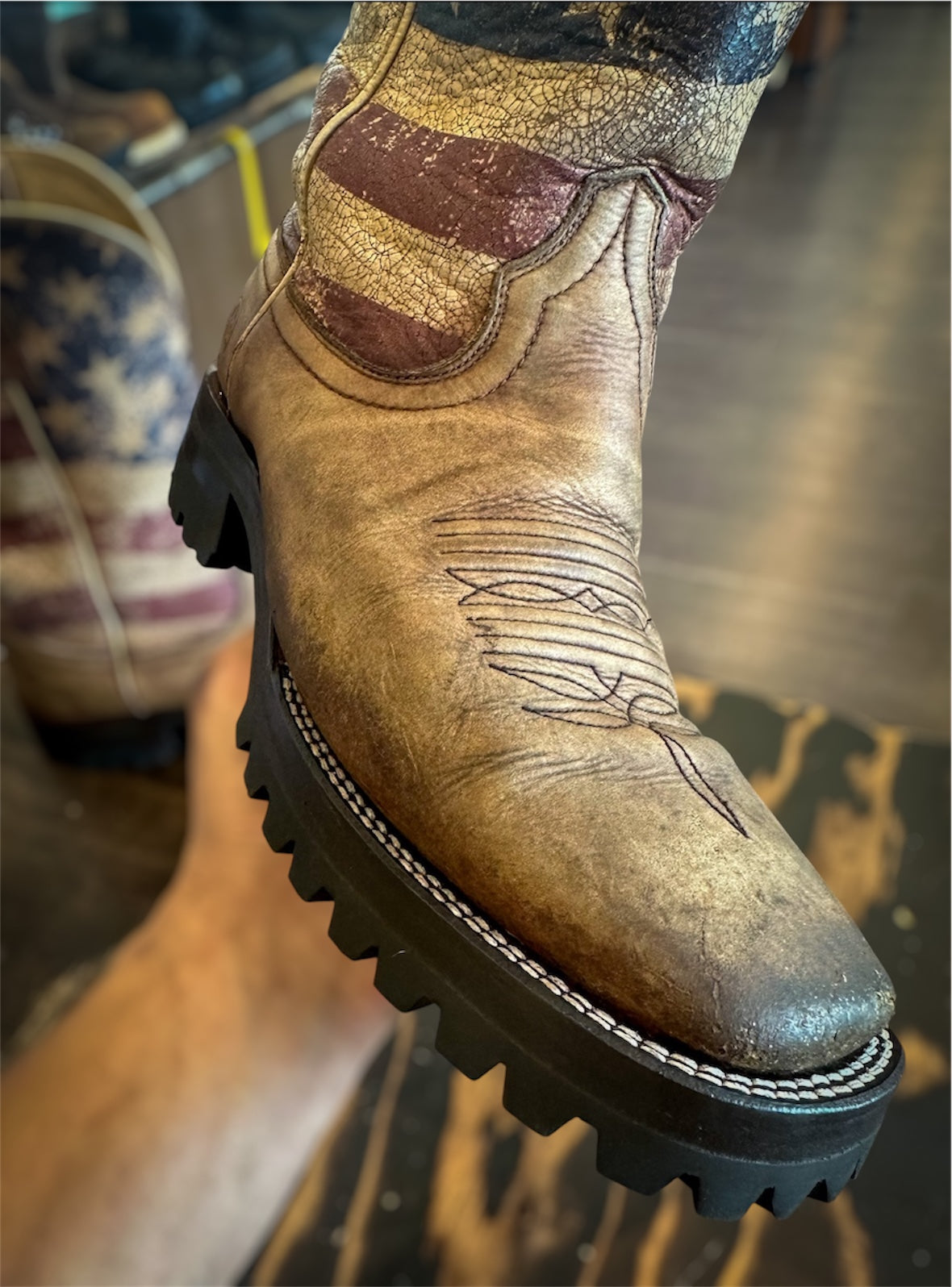 A pair of Ariat Cowboy boots resoled with Vibram 100 lug soles and heels