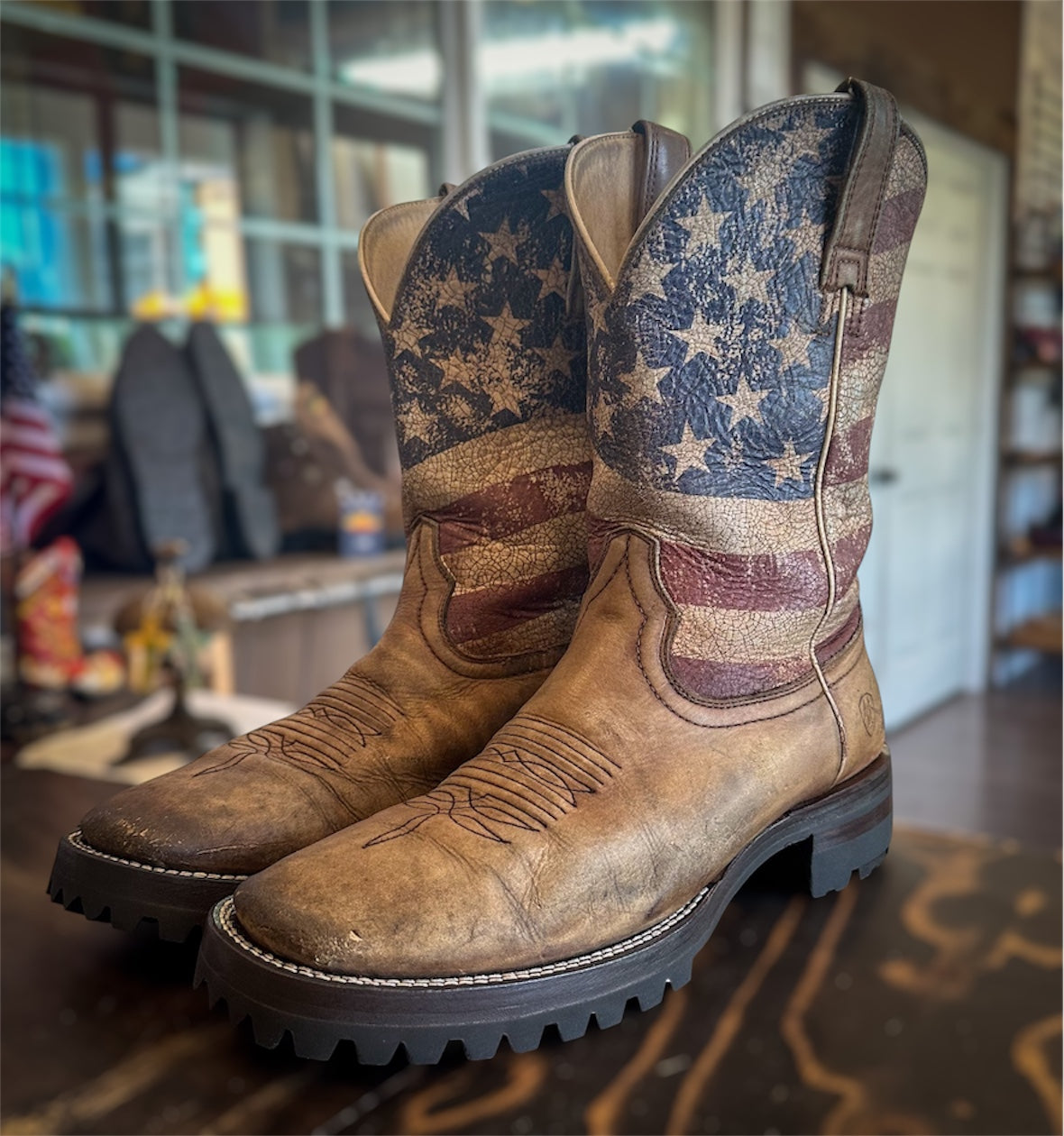 A pair of Ariat Cowboy boots resoled with Vibram 100 lug soles and heels