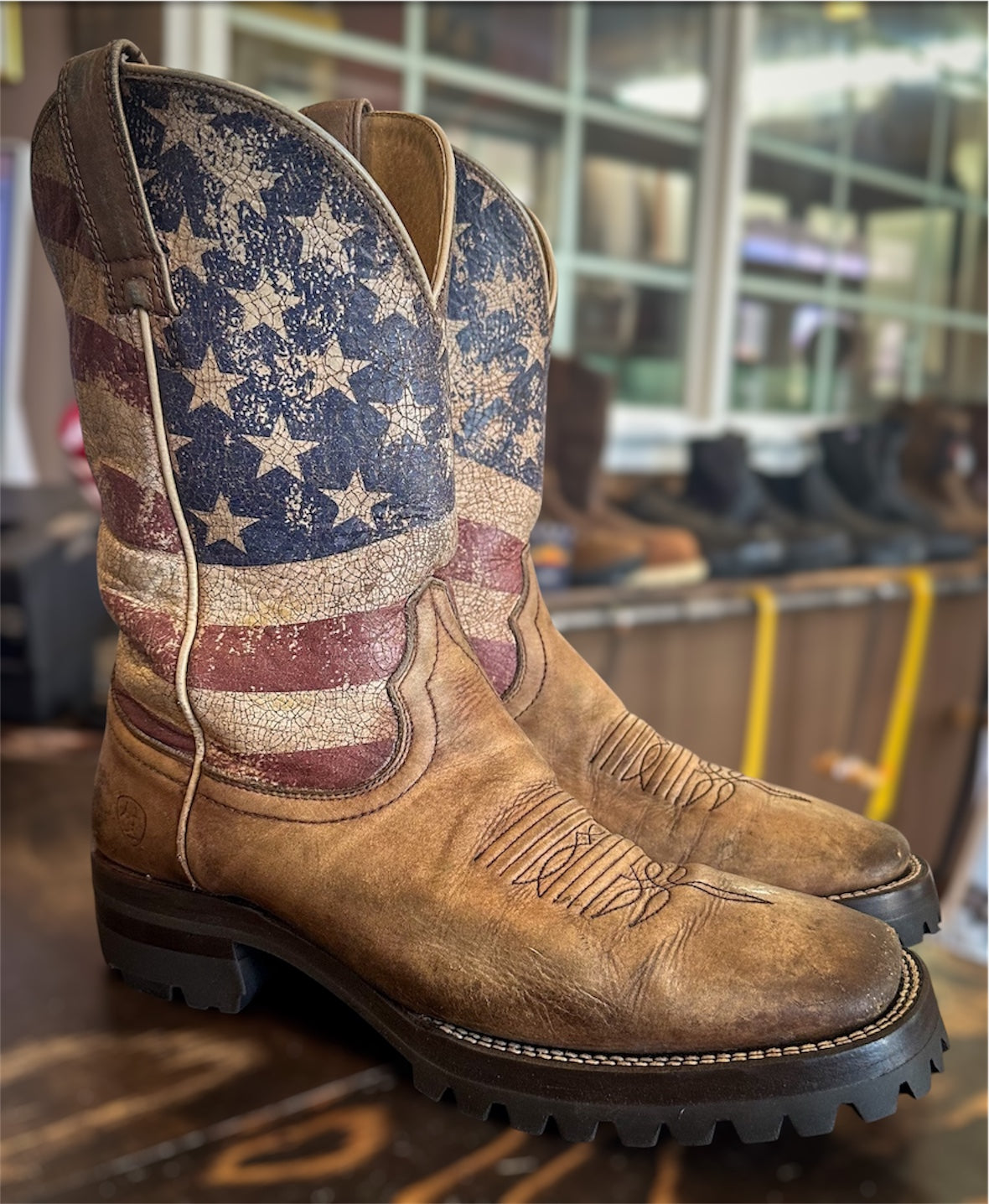 A pair of Ariat Cowboy boots resoled with Vibram 100 lug soles and heels