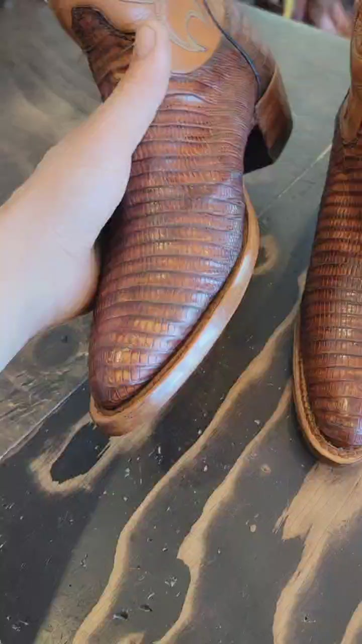 A vintage pair of HYER Lizard skin Cowboy Boots size 8B for sale after being repaired with new leather soles and rubber heels at the cowboy boot repair center