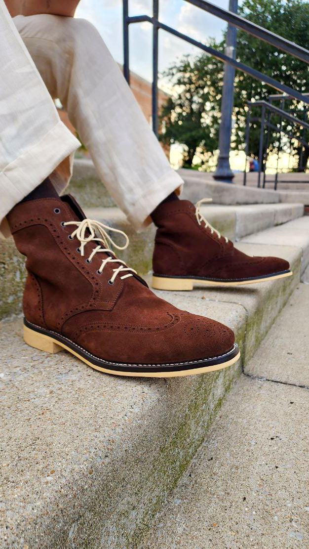 A Pair of Chocolate Brown Suede Wingtips made by Thursday Boot Company and customized with a cream colored Dr Sole Full Soles and Heels. 