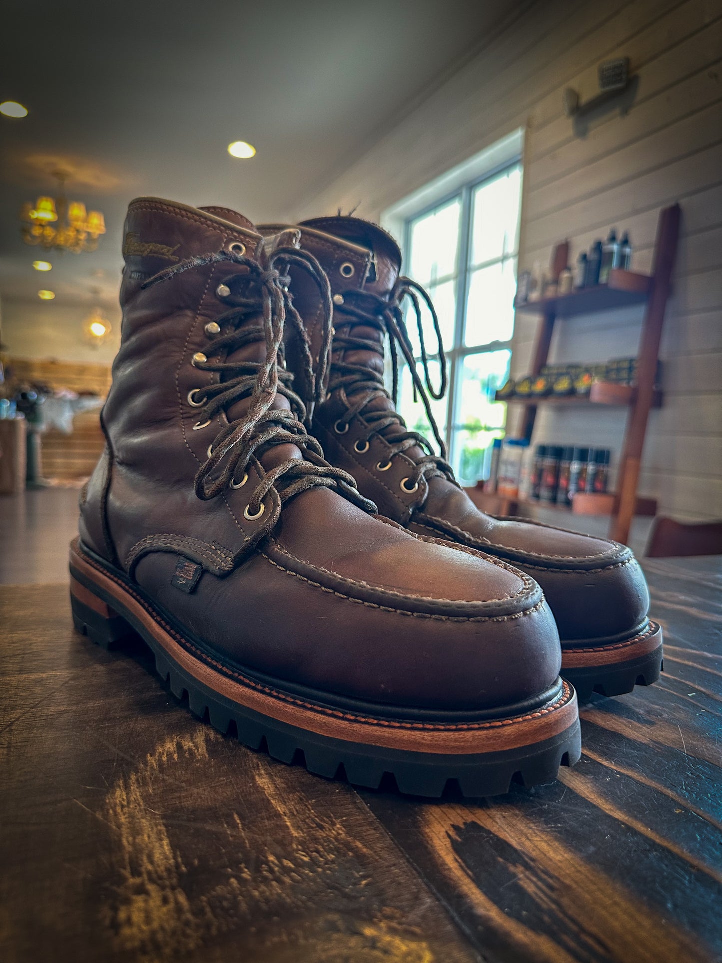 a pair of Thorogood work boots after being repaired with new Vibram 100 Soles and Heels at the boot repair center