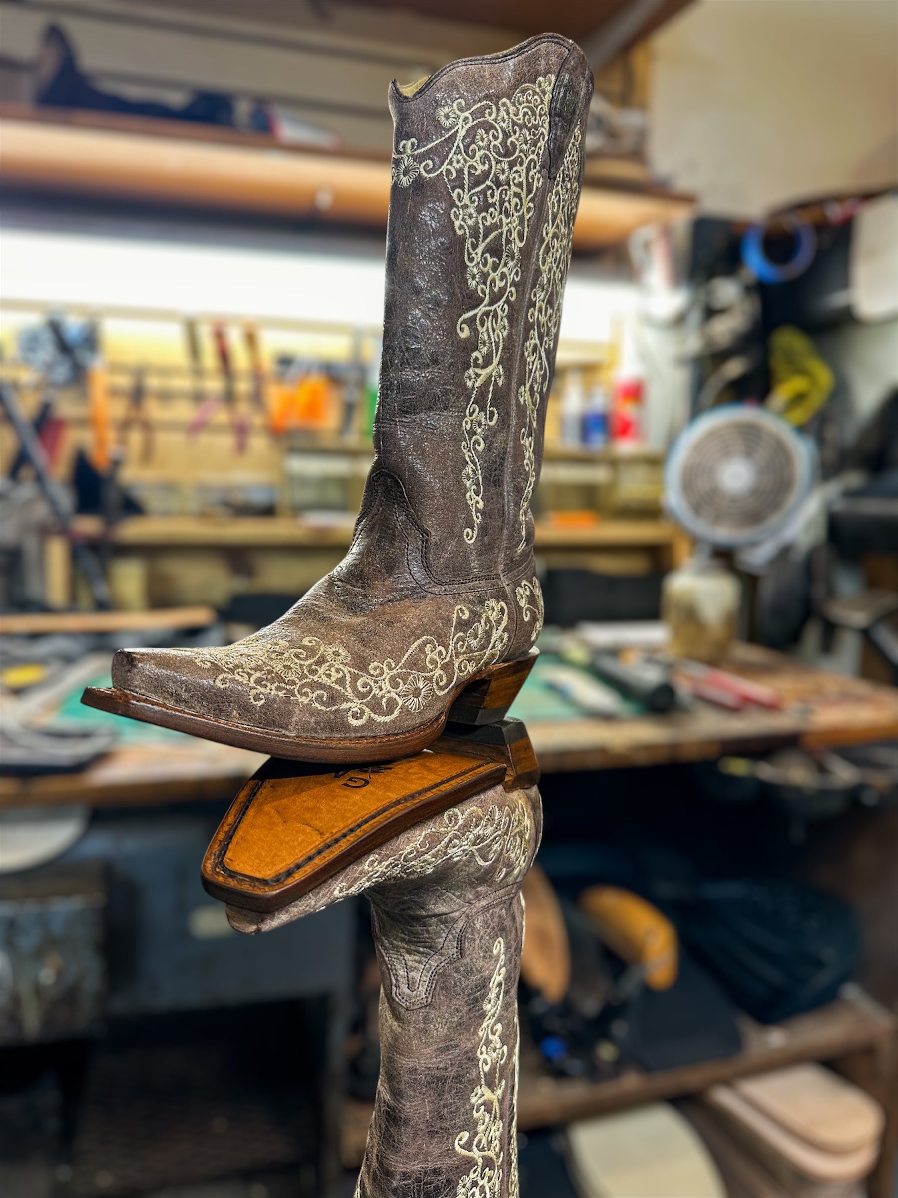 A pair of Women’s Corral Cowboy Boots Repaired with new leather soles and rubber heels