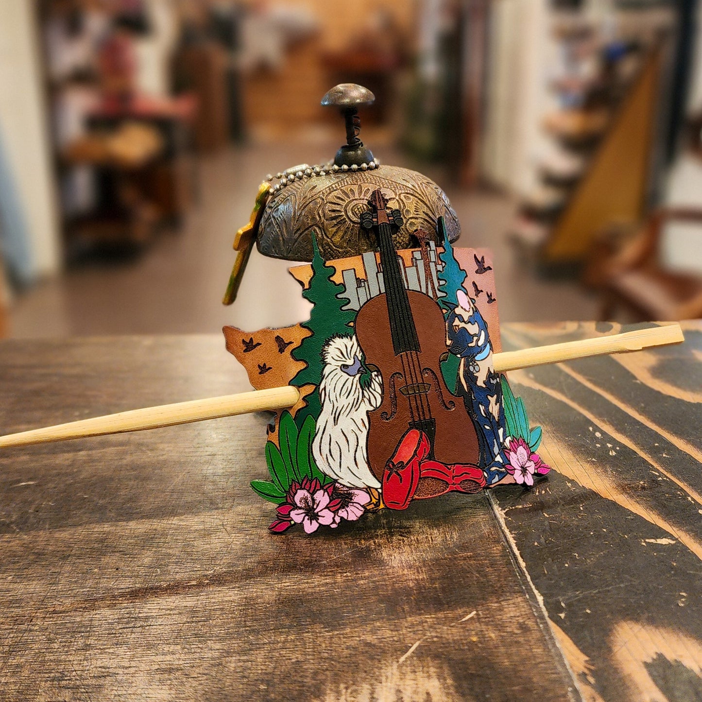Colorful leather hair accessory on a wooden table with a blurred background