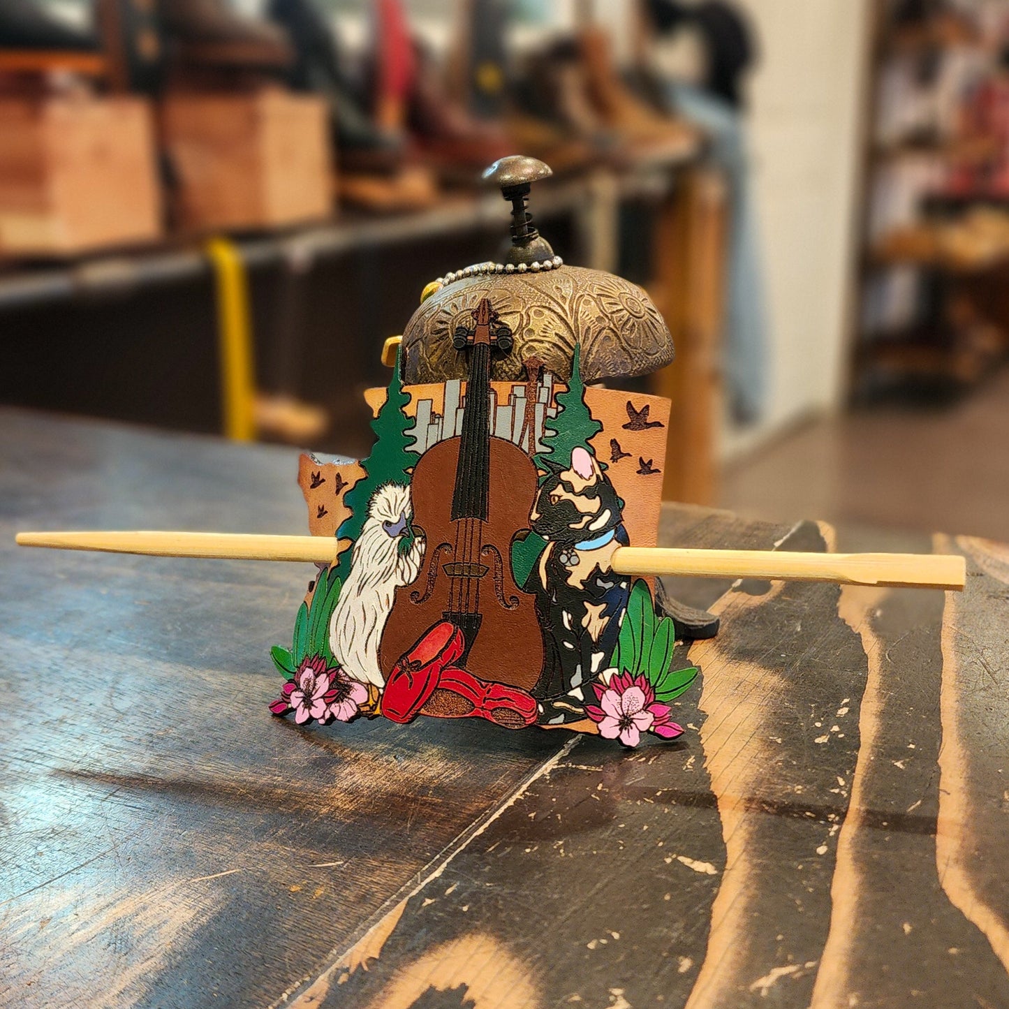 Colorful leather hair accessory on a wooden table with a blurred background