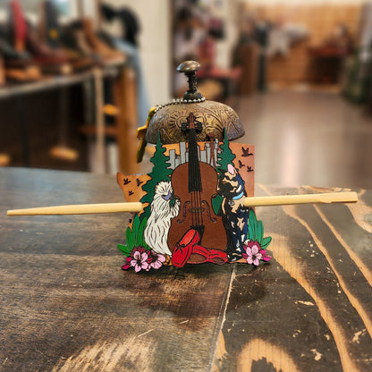 Colorful leather hair accessory on a wooden table with a blurred background