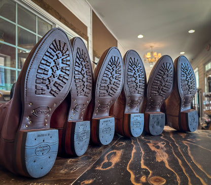 3 pairs of Tecovas Cowboy Boots after being repaired with new Brown Vibram 430 soles at the Cowboy Boot Repair Center