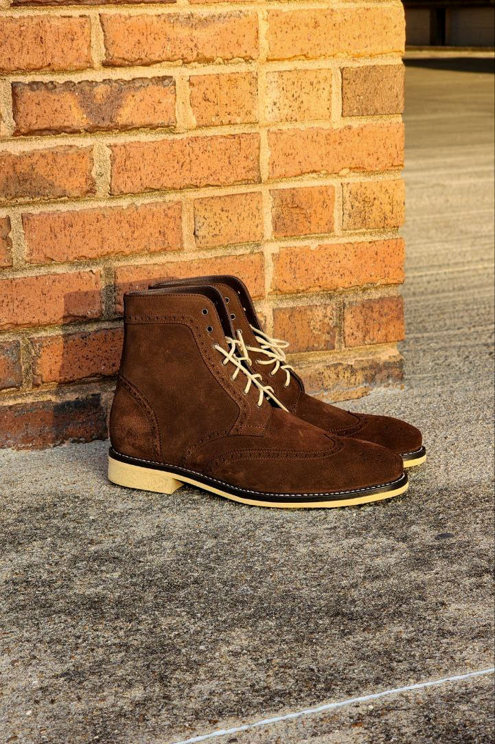 A Pair of Chocolate Brown Suede Wingtips made by Thursday Boot Company and customized with a cream colored Dr Sole Full Soles and Heels. 