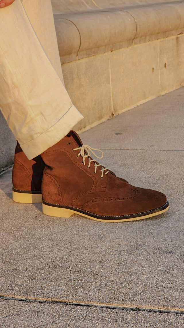 A Pair of Chocolate Brown Suede Wingtips made by Thursday Boot Company and customized with a cream colored Dr Sole Full Soles and Heels. 