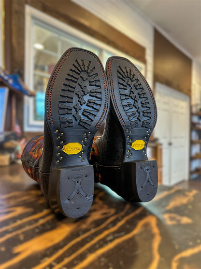 A pair of Black Ariat Caiman Skin Cowboy Boots Repaired with new Vibram 430 soles in black