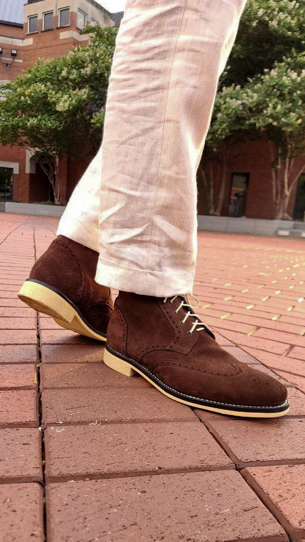 A Pair of Chocolate Brown Suede Wingtips made by Thursday Boot Company and customized with a cream colored Dr Sole Full Soles and Heels. 