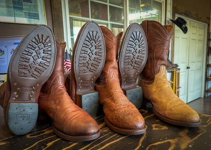 3 pairs of Tecovas Cowboy Boots after being repaired with new Brown Vibram 430 soles at the Cowboy Boot Repair Center