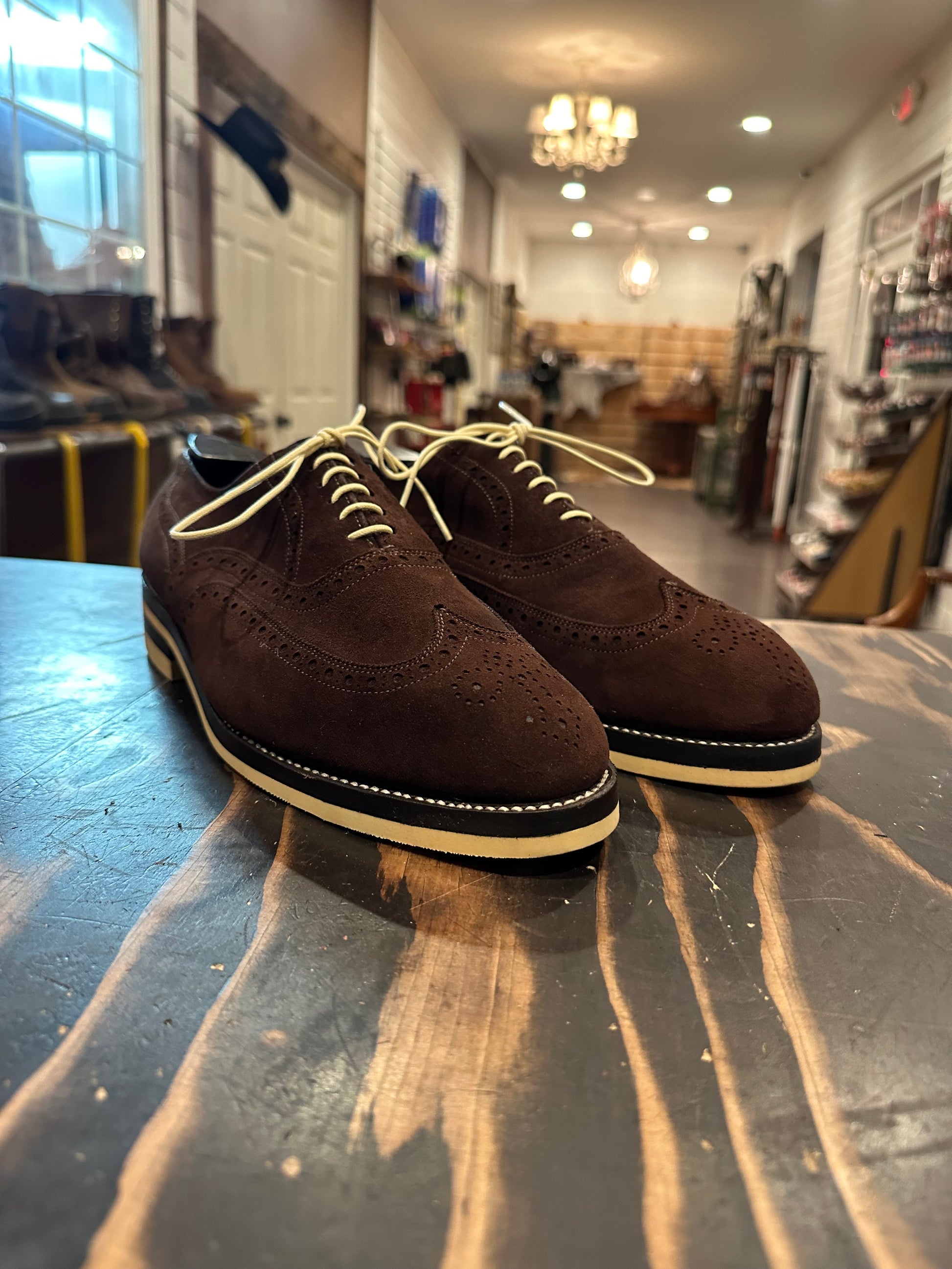 A pair of brown suede wingtip Allen Edmonds dress shoes repaired with Dr Sole cream Full Soles and Heels at the dress shoe repair center