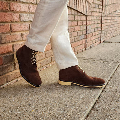 A Pair of Chocolate Brown Suede Wingtips made by Thursday Boot Company and customized with a cream colored Dr Sole Full Soles and Heels. 