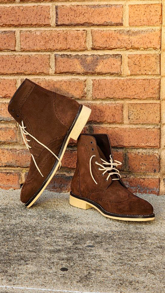 A Pair of Chocolate Brown Suede Wingtips made by Thursday Boot Company and customized with a cream colored Dr Sole Full Soles and Heels. 