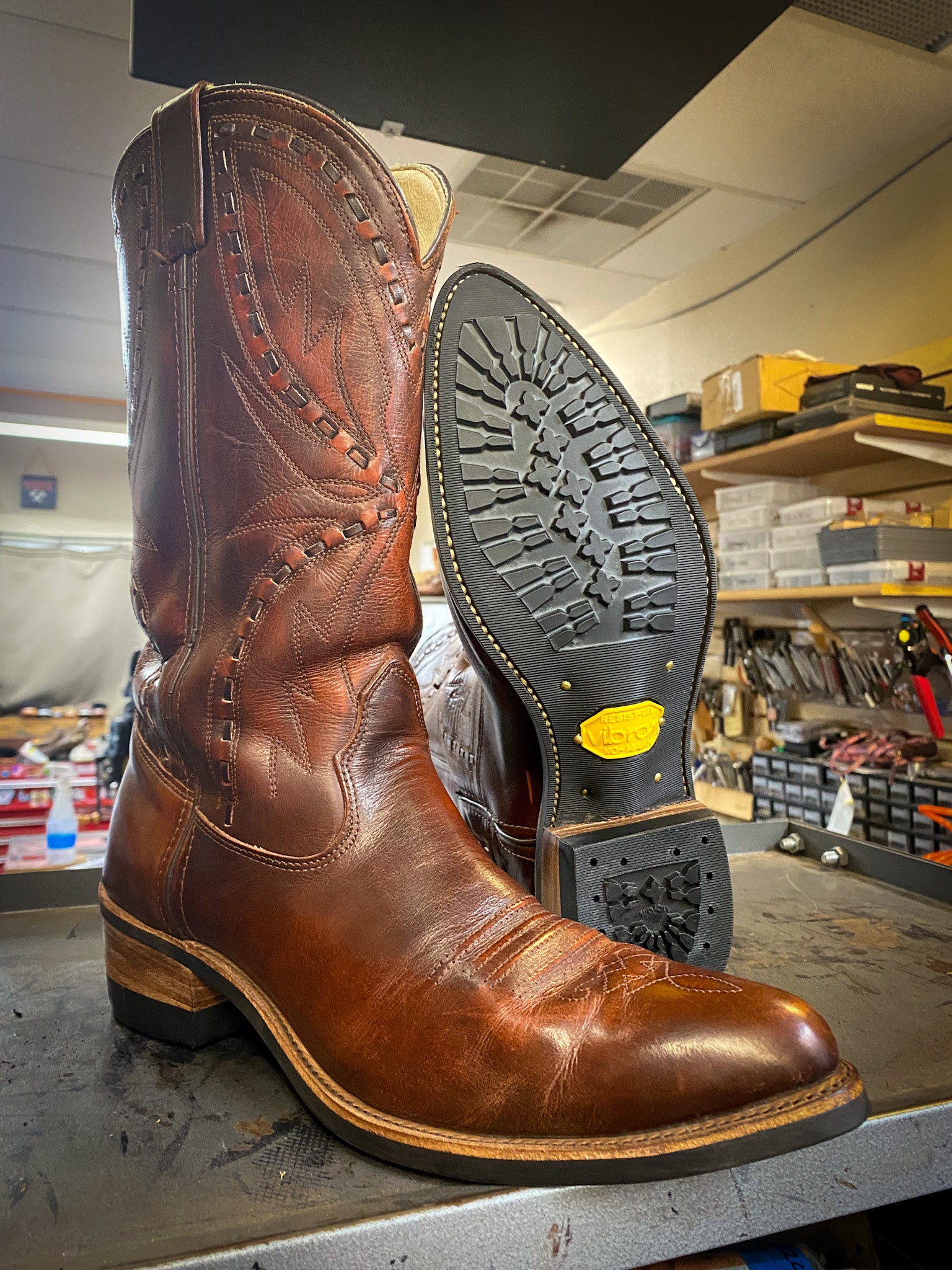 A pair of Double H Cowboy Boots after being repaired with new Vibram 430 min lug soles at the cowboy boot repair center