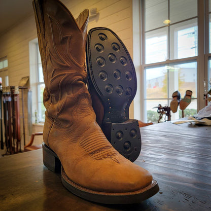 A pair of square toe Thursday Boot Cowboy Boots after being repaired with new Dainite Soles and Heels at the Cowboy Boot Repair Center