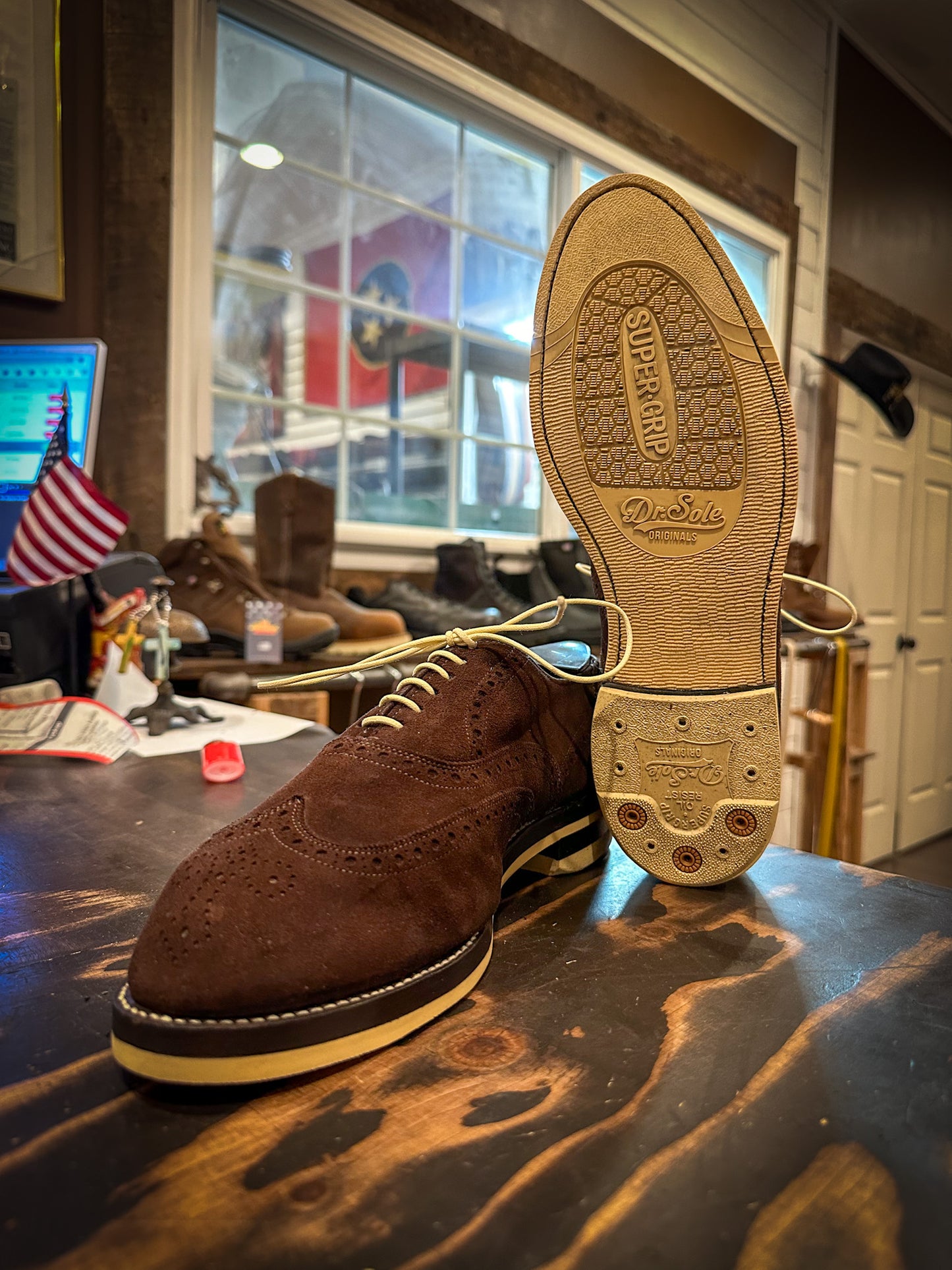 a pair of brown suede wingtip Allen Edmonds Dress shoes repaired with new Dr Sole Cream Full Soles and Heels at the dress shoe repair center