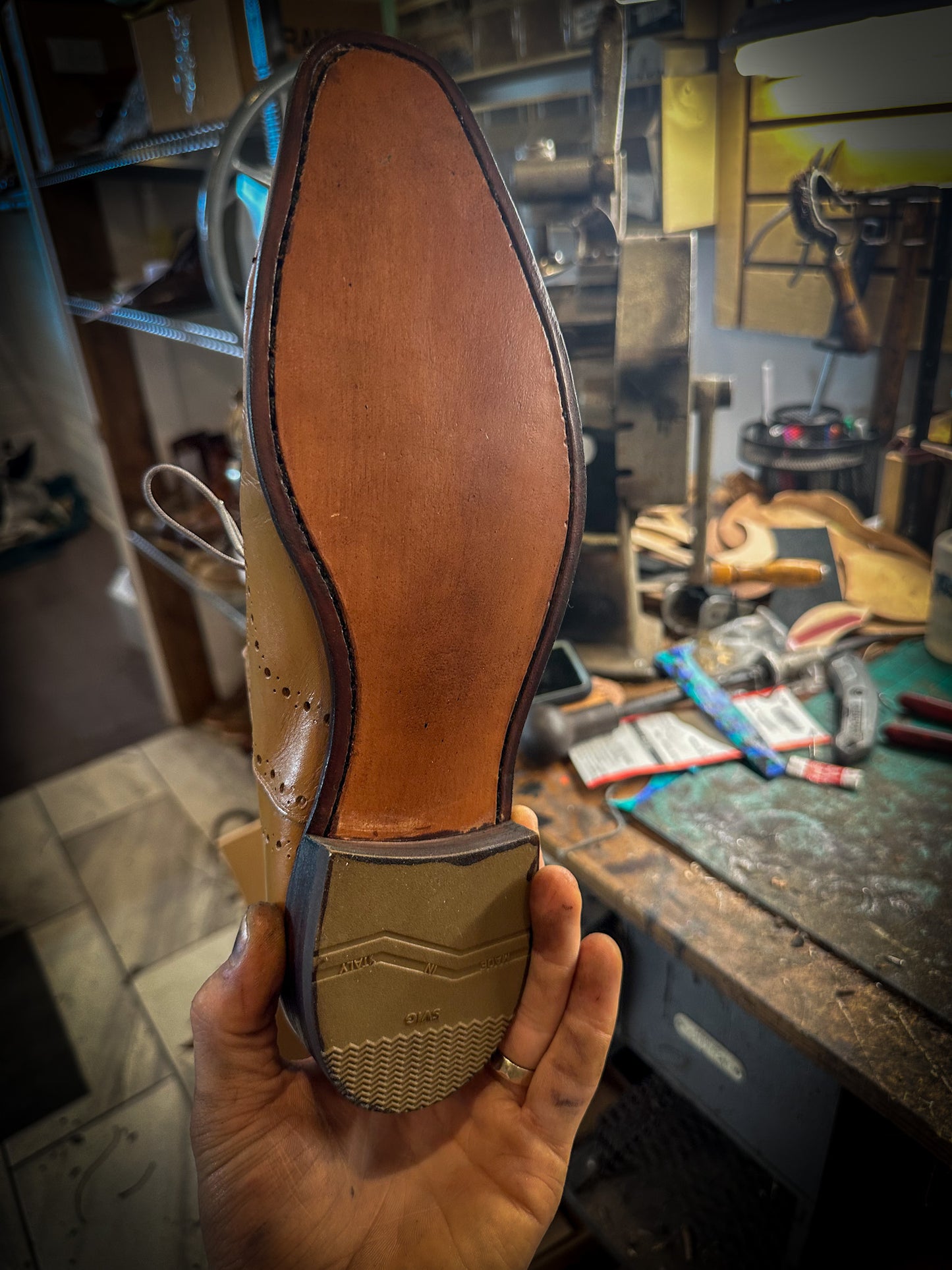 a pair of Ferragamo Dress shoes after being repaired with new leather soles at the dress shoe repair center