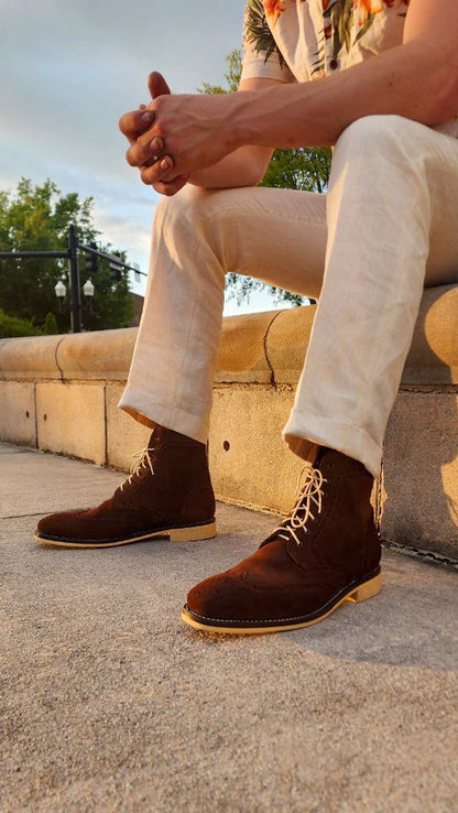 A Pair of Chocolate Brown Suede Wingtips made by Thursday Boot Company and customized with a cream colored Dr Sole Full Soles and Heels. 