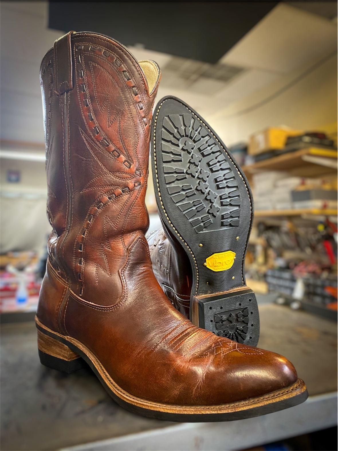 A pair of Double H Cowboy Boots Repaired with new Vibram 430 soles in black