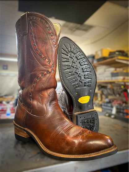 A pair of Double H Cowboy Boots Repaired with new Vibram 430 soles in black