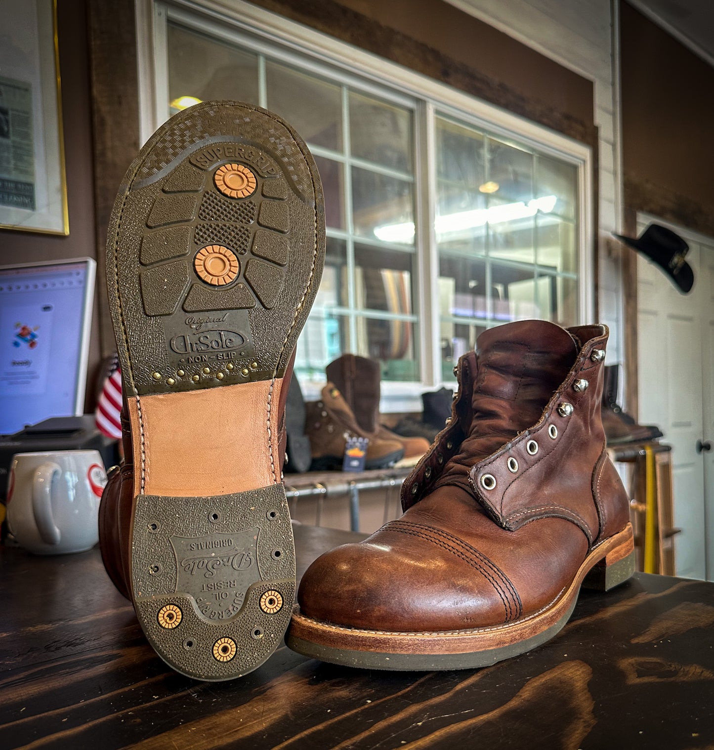 A pair of Redwing Iron Ranger Repaired with new DR sole Half soles and Heels at the boot repair center