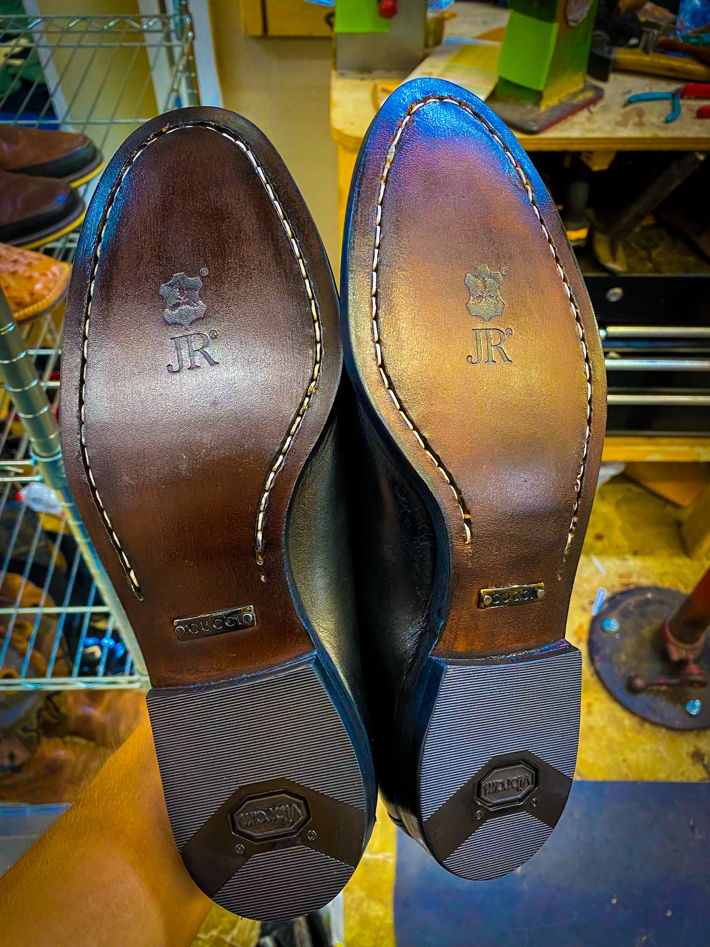 A pair of Gucci Dress Shoes after being repaired with new JR leather soles at the dress shoe repair center