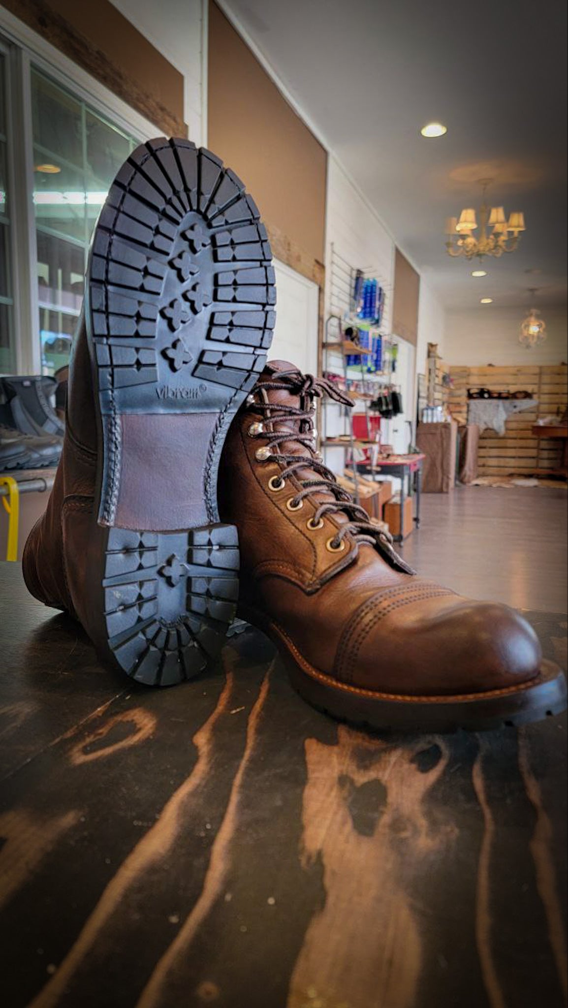 A pair of Redwing Iron Ranger Boots after being repaired with Vibram Mini Lug Half Soles and Redwing Heels at the Boot Repair Shop