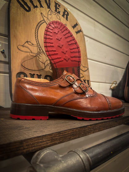 a pair of double monk strap dress shoes repaired with new red mini lug half soles and heels at the dress shoe repair center