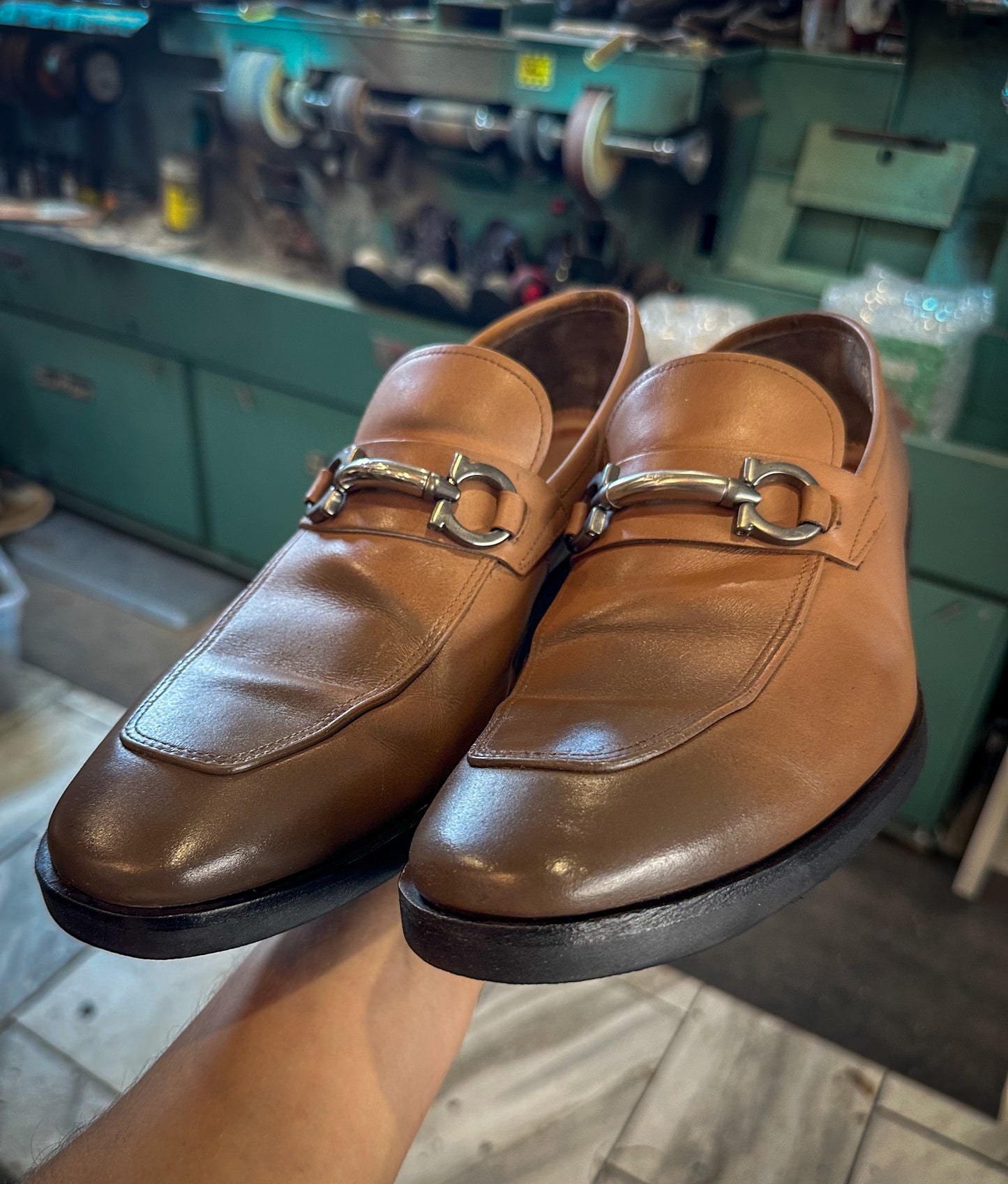 a pair of Ferragamo dress shoes after being repaired with new Vibram 700 soles and heels at the dress shoe repair center