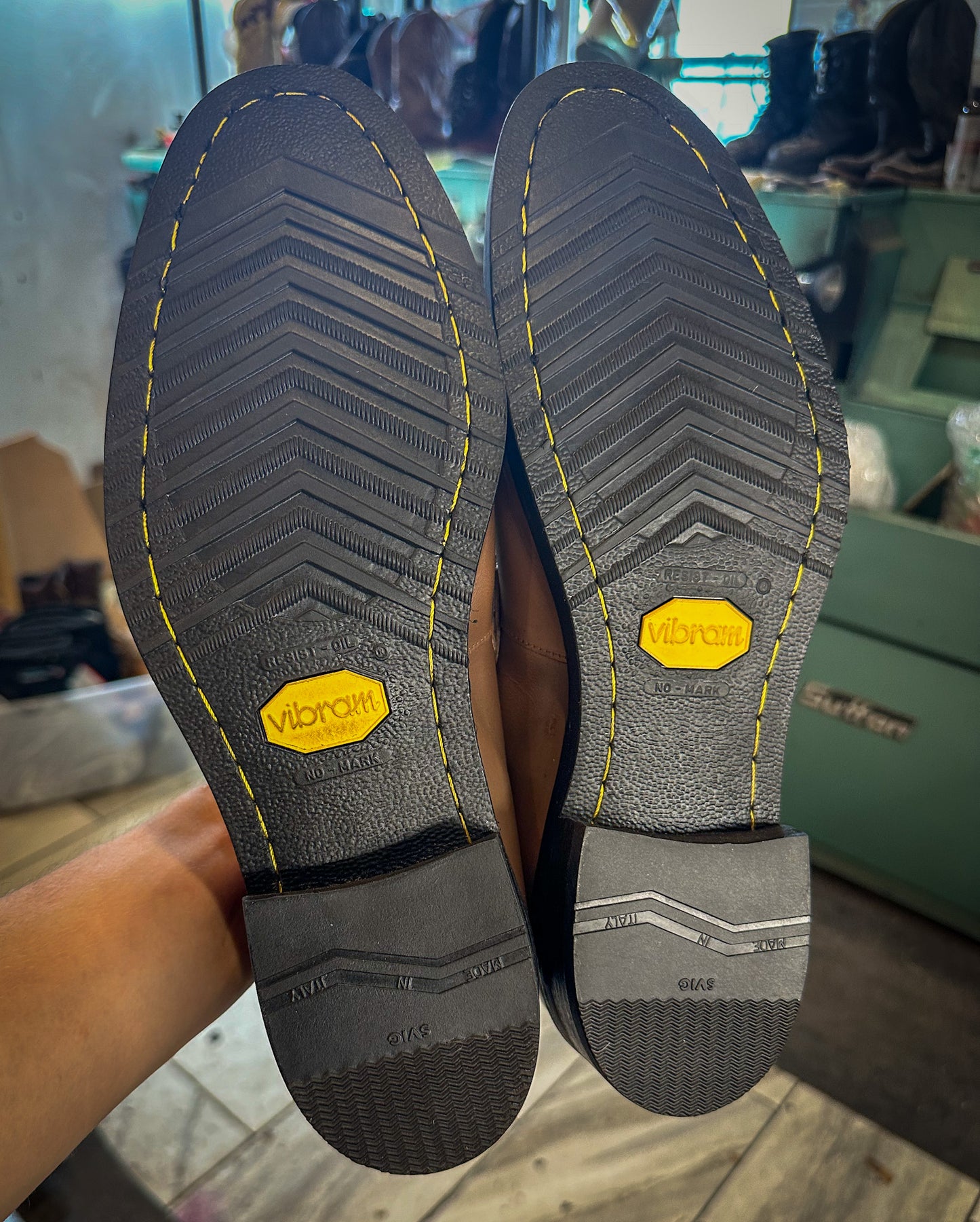 a pair of Ferragamo dress shoes after being repaired with new Vibram 700 soles and heels at the dress shoe repair center