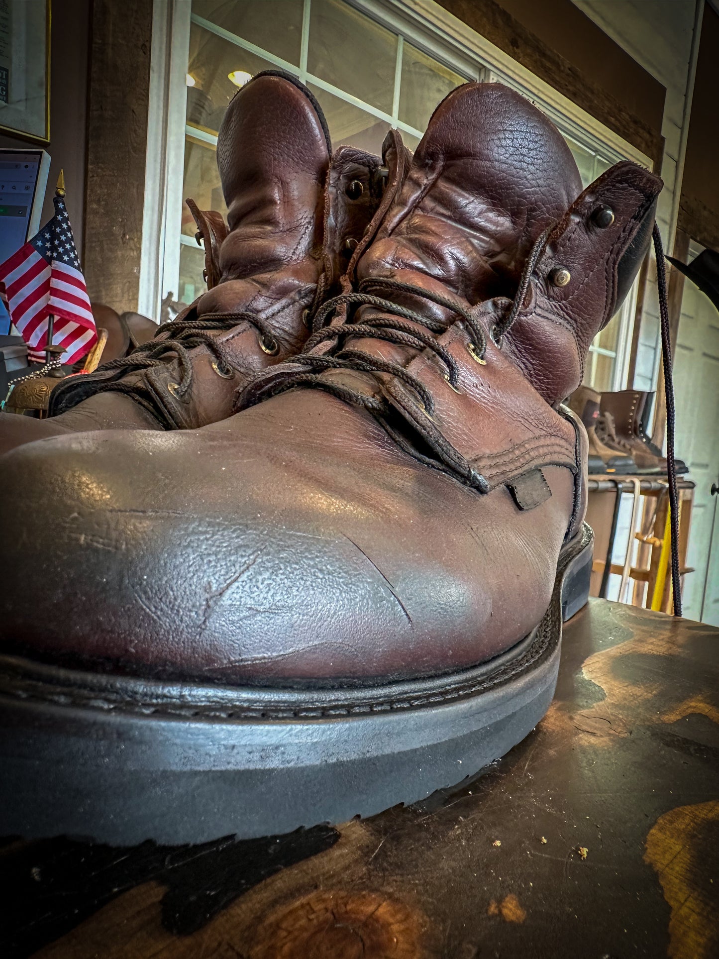 A pair of Redwing work boots after being repaired with new Vibram Long Haul Soles at the Boot Repair Center