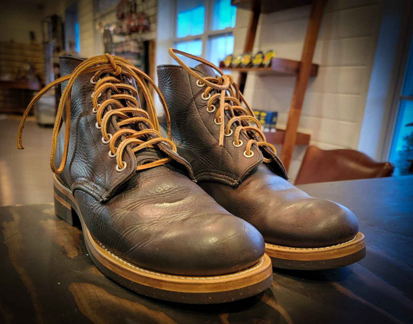 A pair of Redwing Boots after being repaired with new Vibram 700 Tygum soles and heels at the boot repair center