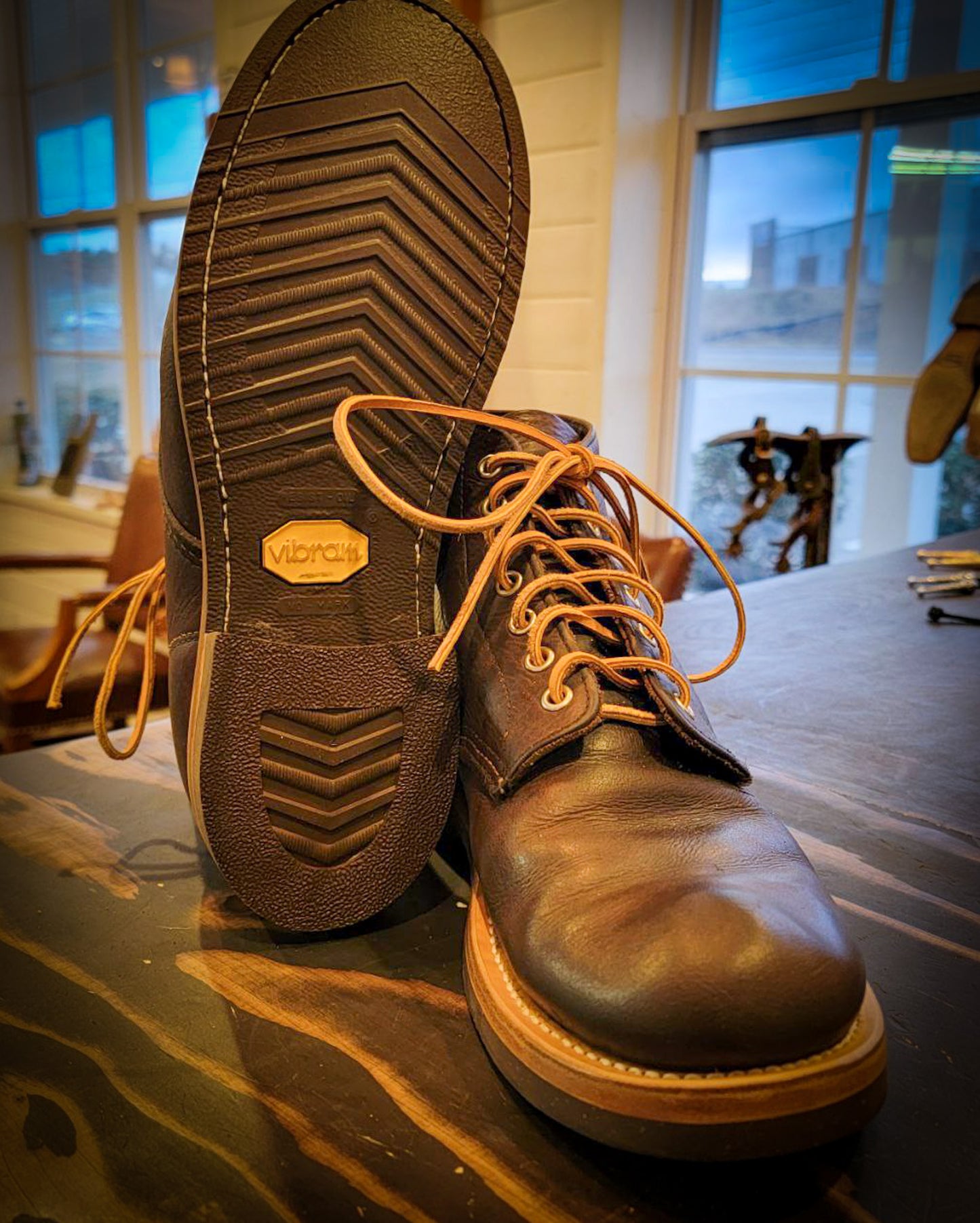 A pair of Redwing Boots after being repaired with new Vibram 700 Tygum soles and heels at the boot repair center