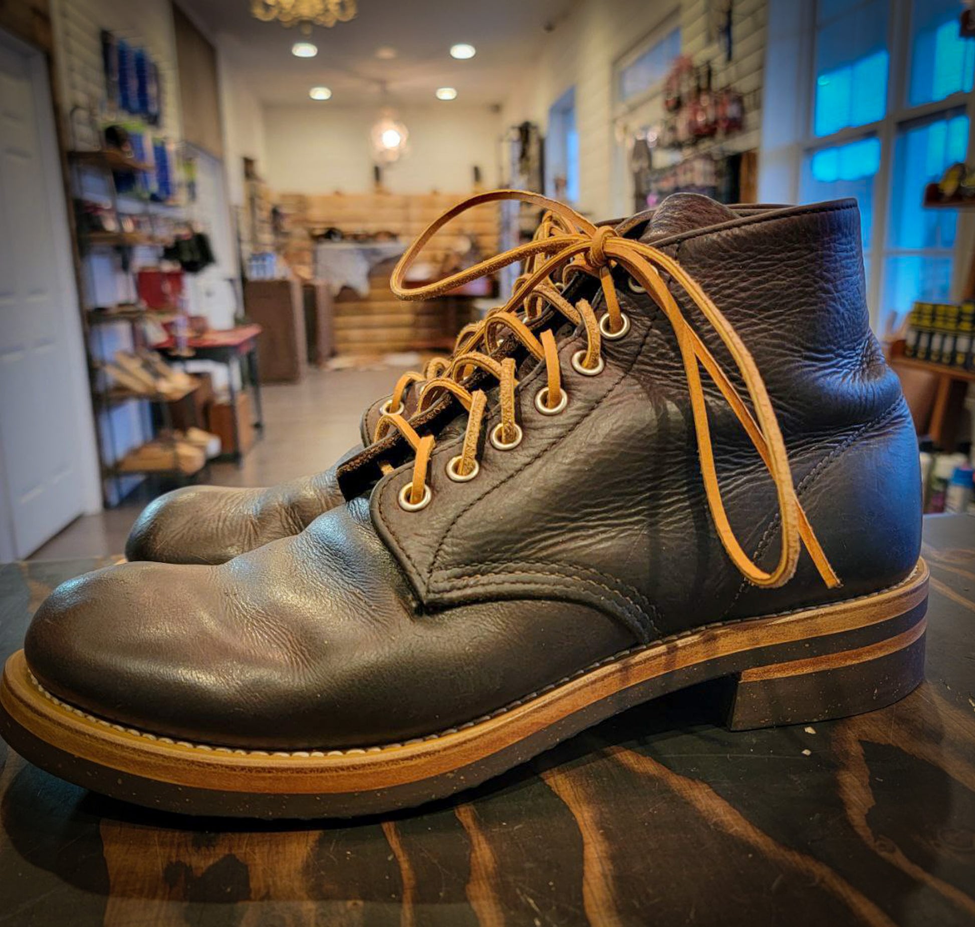 A pair of Redwing Boots after being repaired with new Vibram 700 Tygum soles and heels at the boot repair center